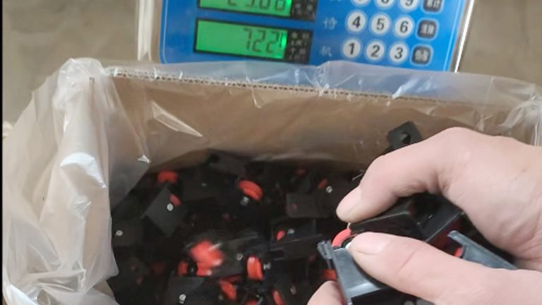 Packed rollers are being weighed before shipment.
